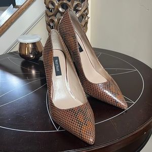 Never worn White house black market Olivia leather exotic print pumps.